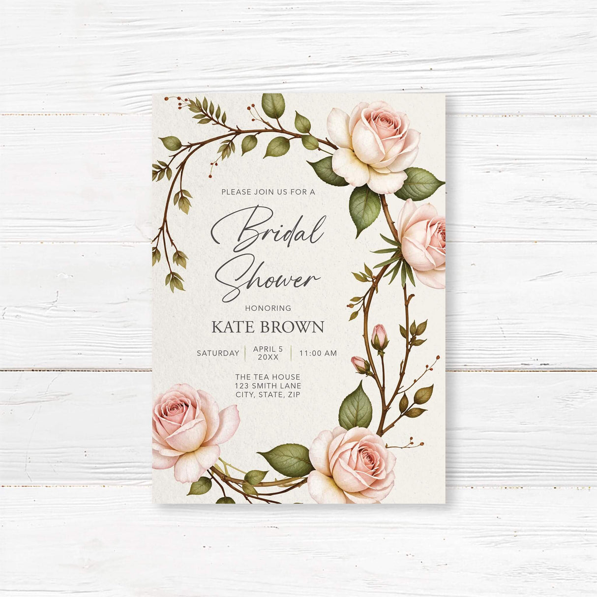 Romantic bridal shower invitation with soft blush roses and greenery in a vintage floral design, printed on premium cardstock.