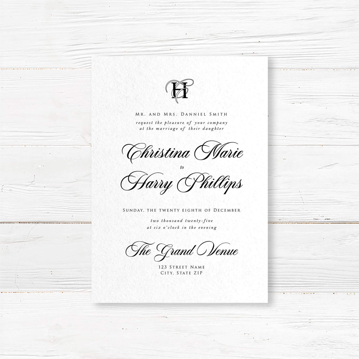 Elegant black and white wedding invitation with entwined initials monogram and formal typography