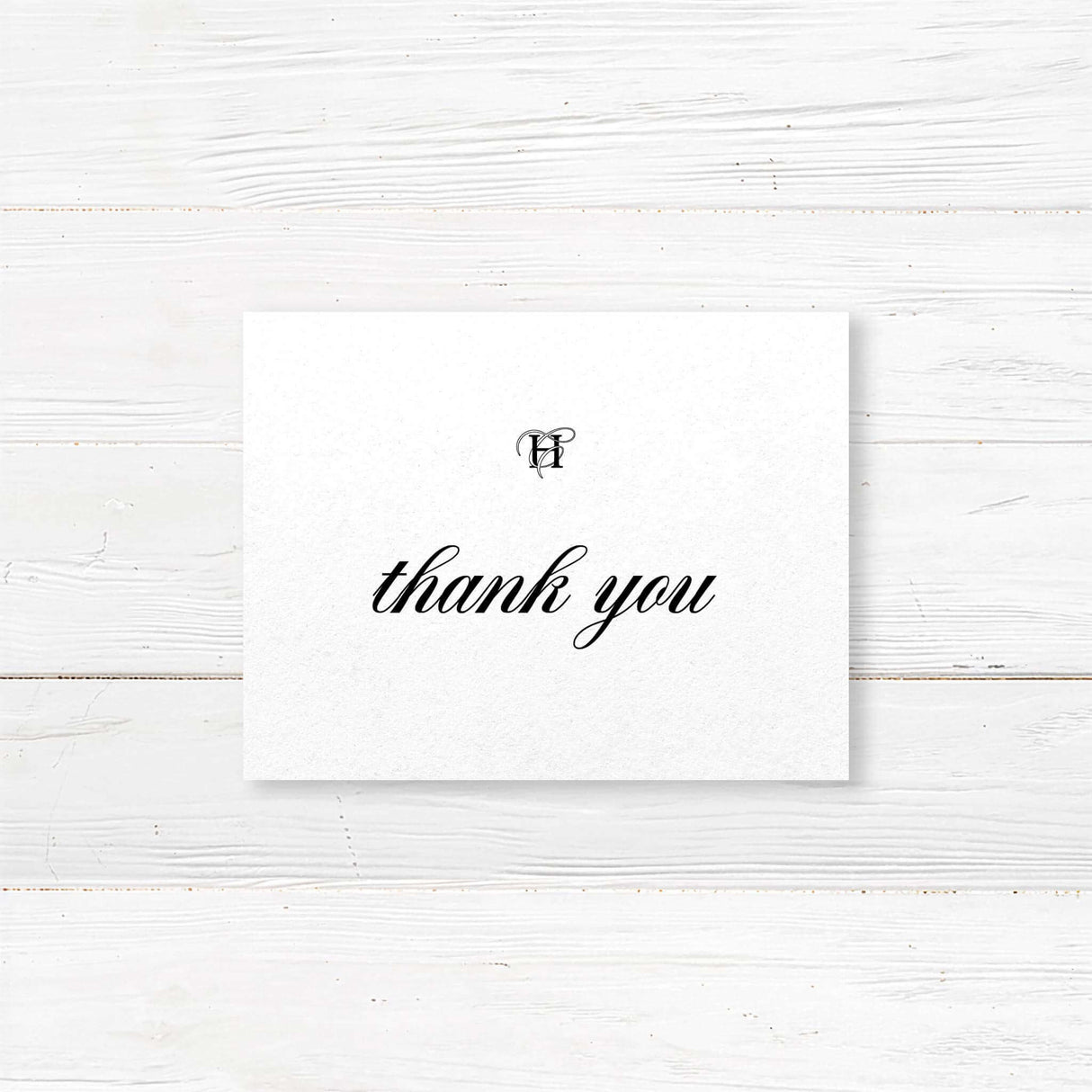 Elegant black and white thank you card with monogram and serif font for wedding gratitude