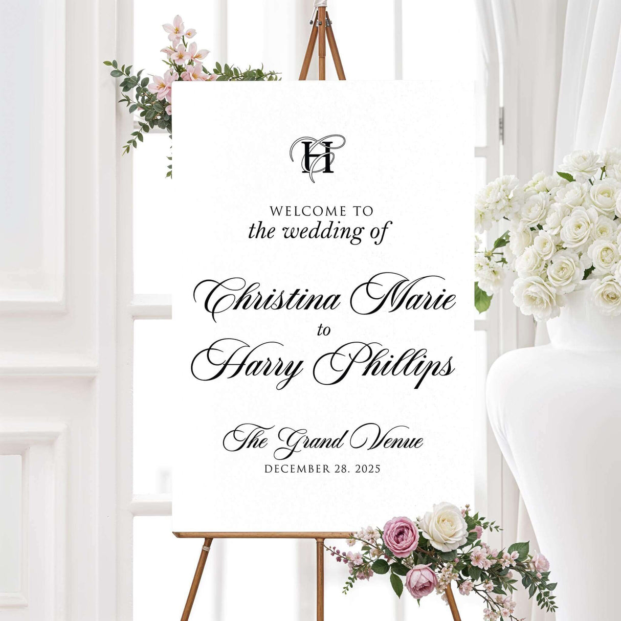 Black and white printed wedding welcome sign with monogram initials and classic font