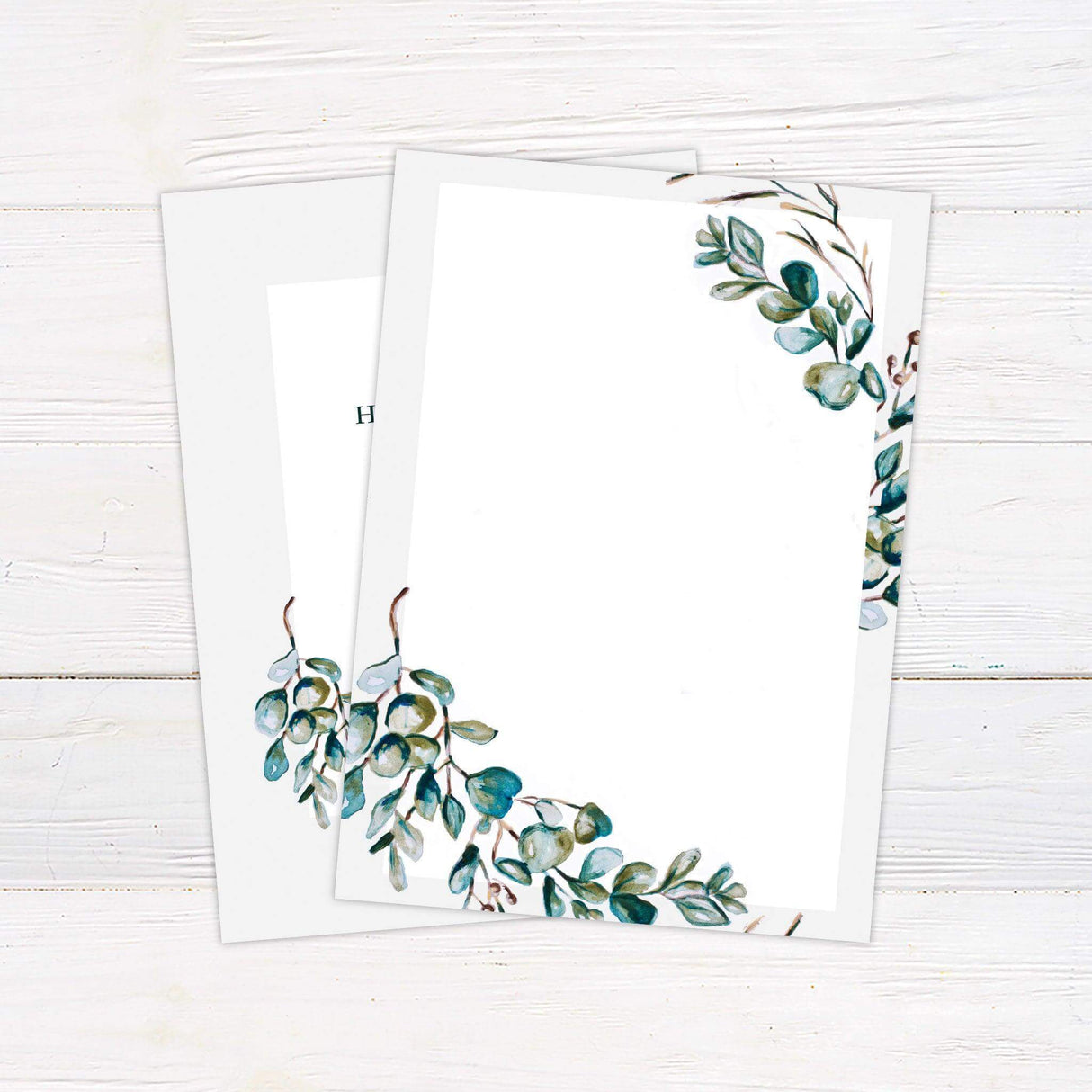 Wedding invitation with watercolor eucalyptus wreath, elegant serif text, and botanical accents, ideal for rustic, garden, or nature-themed weddings. - back