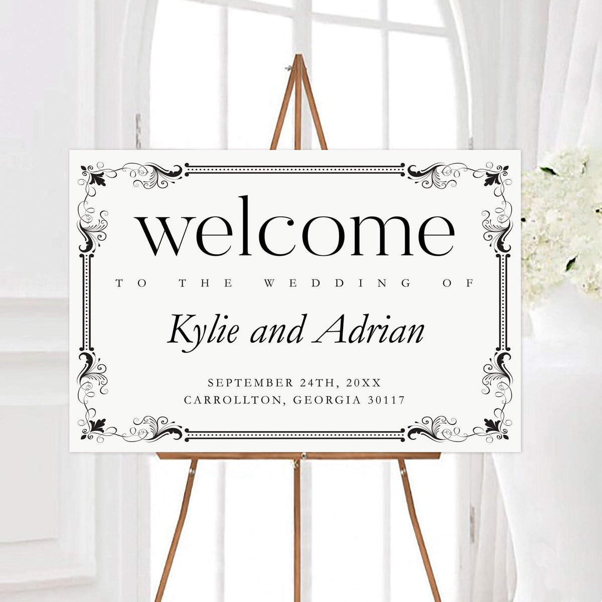 Personalized exquisite border wedding welcome sign featuring an ornate decorative border and elegant black typography. The design includes the couple’s names, wedding date, and location.
