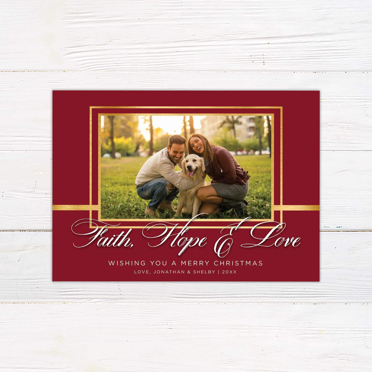 Custom Christmas card with burgundy background, gold frame accents, and elegant script text reading Faith, Hope and Love with space for a family photo.