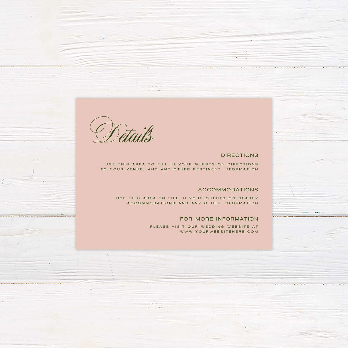 Blush pink wedding details card with elegant green script font, minimal floral accent, and classic layout.