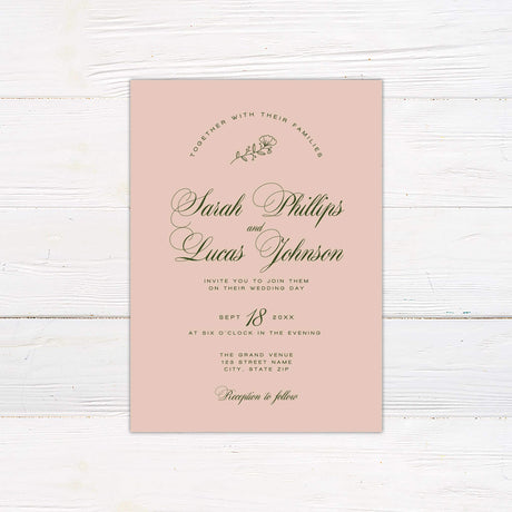 Blush pink wedding invitation with elegant green script font, minimal floral accent, and classic layout.