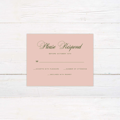 Blush pink wedding RSVP card with elegant green script font, minimal floral accent, and classic layout.