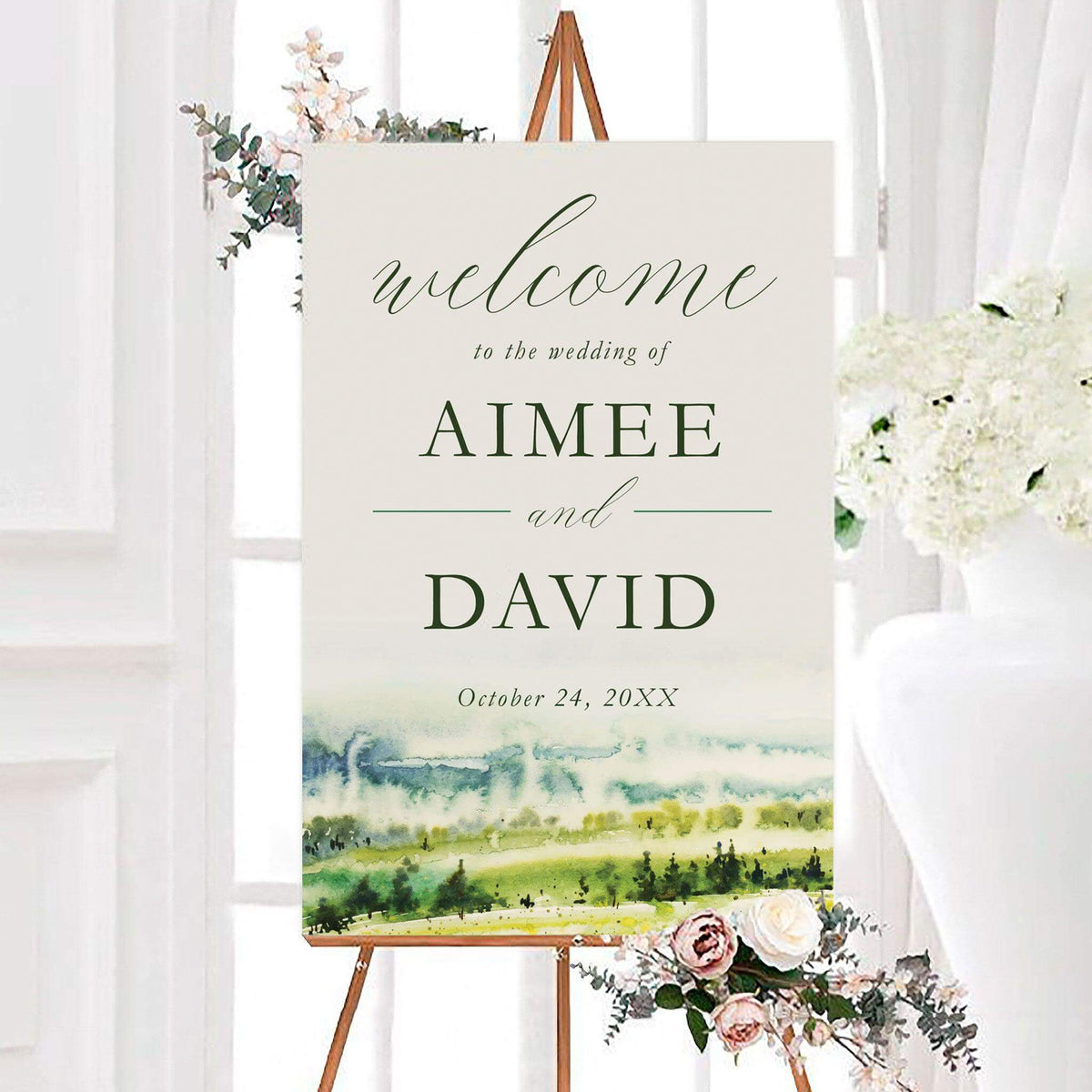 Farmland views wedding welcome sign featuring personalized names and a soft watercolor countryside landscape. Rolling green fields, distant hills, and elegant script create a peaceful nature-inspired design.