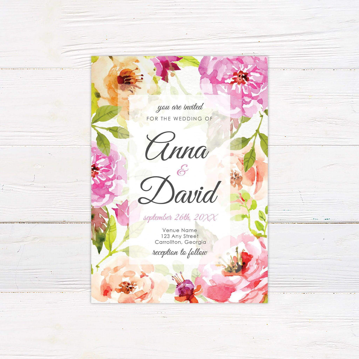 Colorful watercolor wedding invitation with a pink and peach floral border and elegant script text on a white background