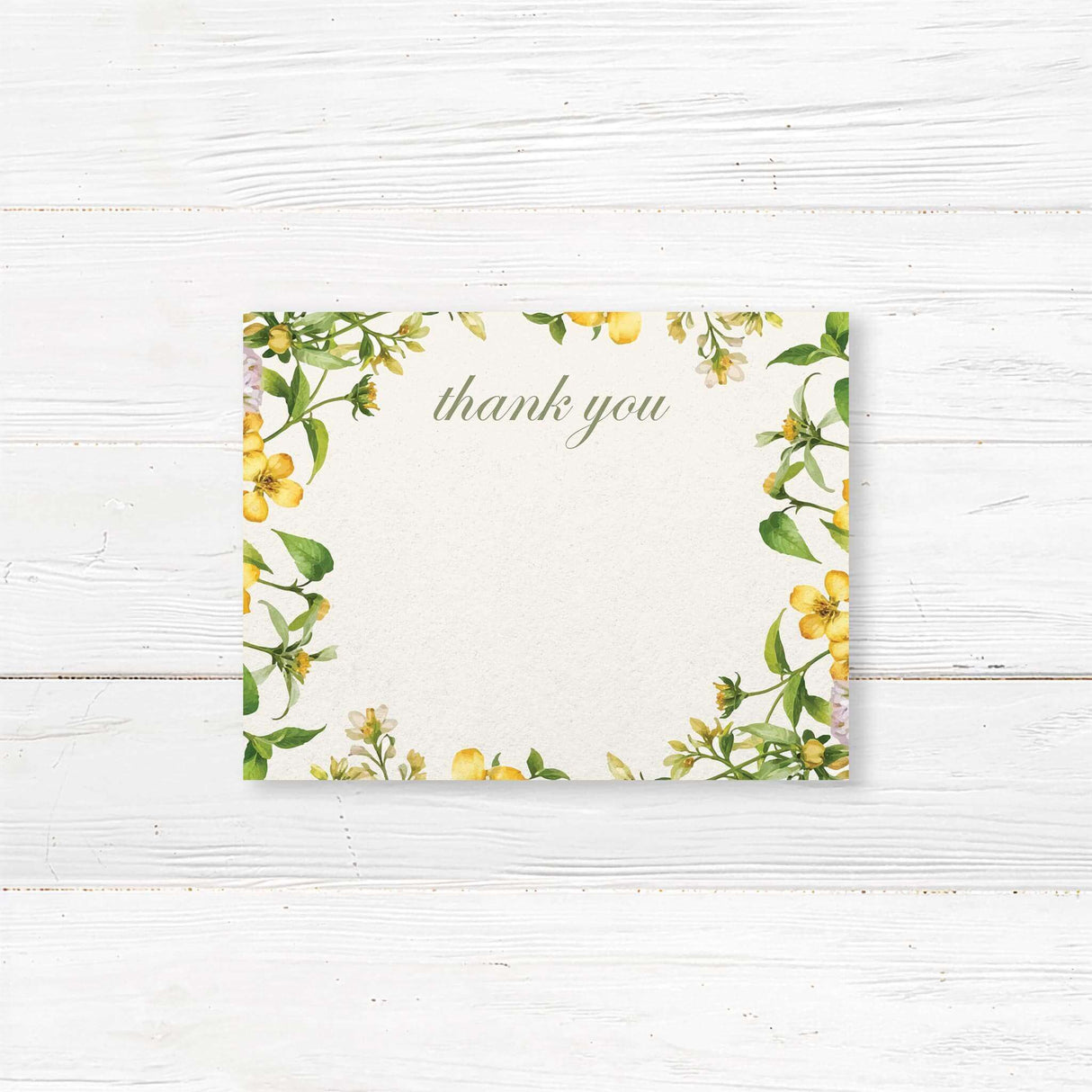 Bridal shower thank-you card with a watercolor floral garland in yellow and green, printed on premium cardstock.