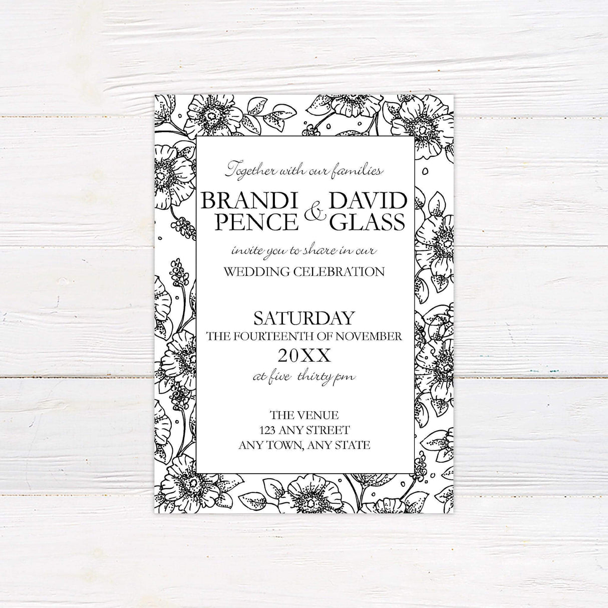 Black and white wedding invitation with hand-drawn floral border and elegant serif and script text layout