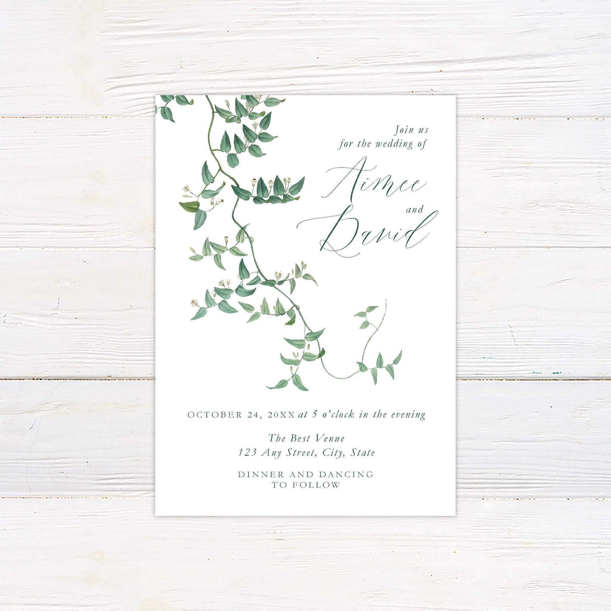 Elegant wedding invitation featuring a watercolor flowering vine design with delicate green leaves and minimalist calligraphy.