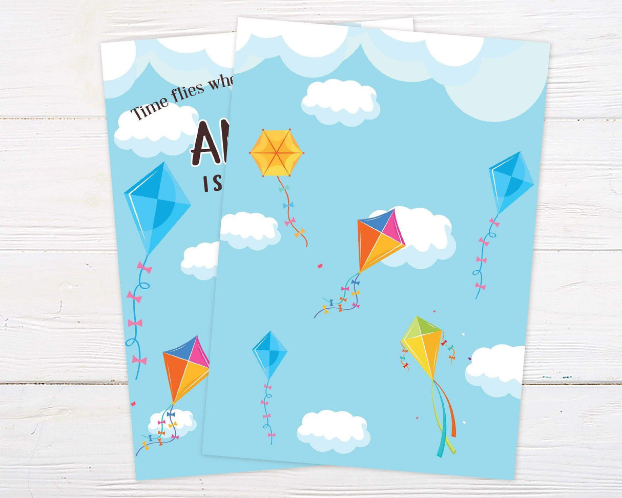 Colorful kite-themed birthday invitation featuring bright kites, fluffy clouds, and playful typography on a blue sky background. Perfect for an outdoor, spring, or summer birthday party. Back.