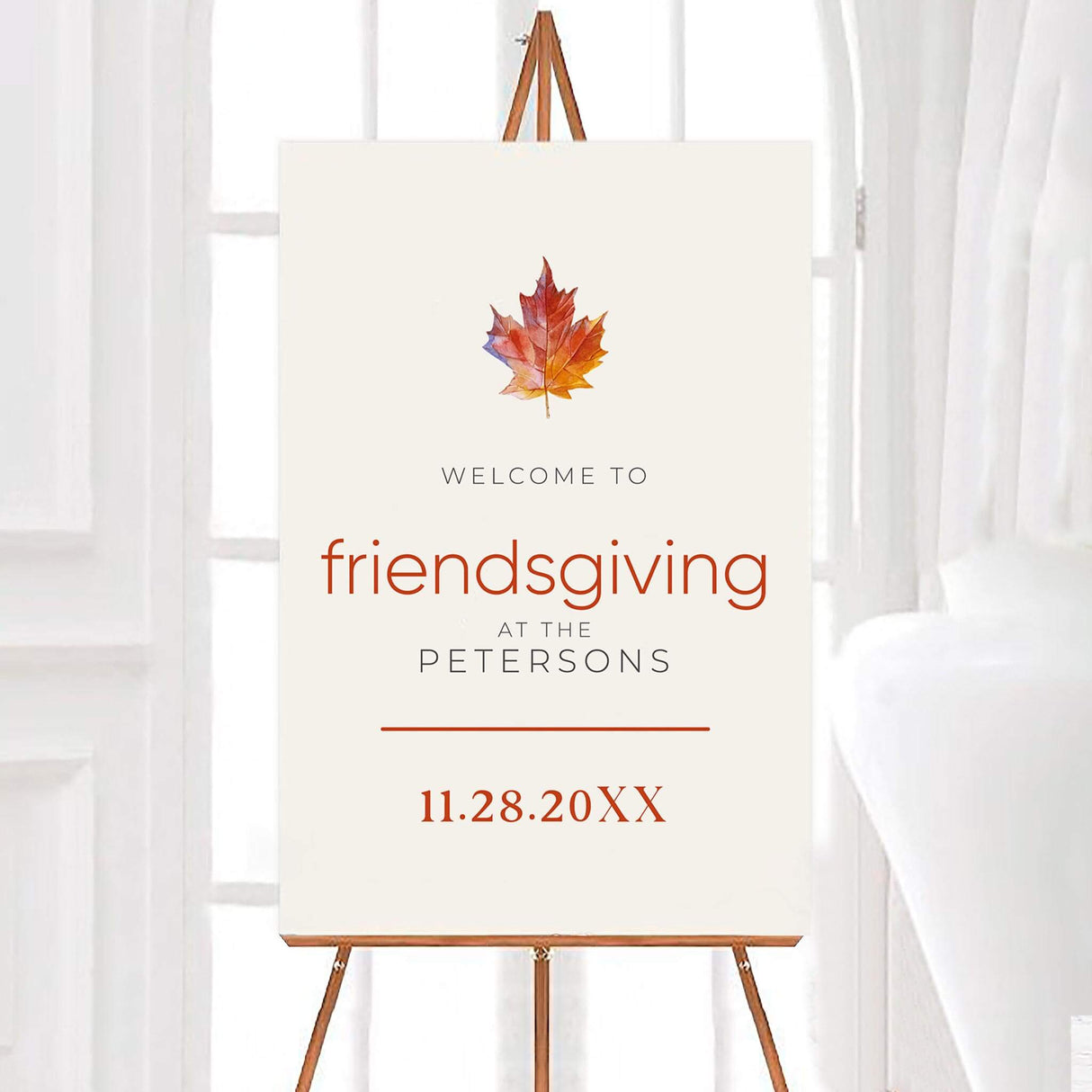 Welcome sign for Friendsgiving celebration with autumn leaf design.