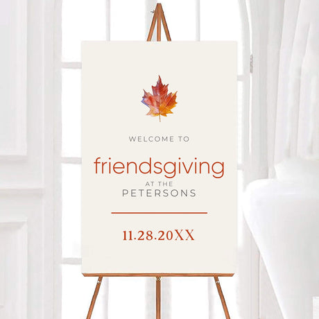 Welcome sign for Friendsgiving celebration with autumn leaf design.