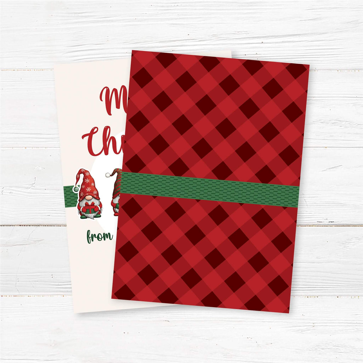 Christmas card with six festive gnomes and text reading "Merry Christmas from our gnome to yours" on a light cream background. back side