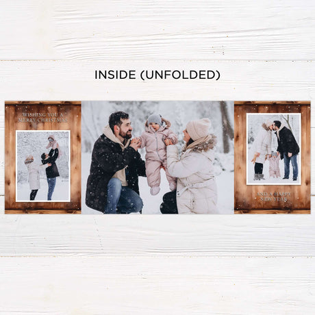 This gatefold holiday card features a cozy woodgrain background with a snow-dusted edge and watercolor floral wreath. Inside, it displays framed photos, festive typography with “Wishing You a Merry Christmas and a Happy New Year,” and a monogram accent. - inside.