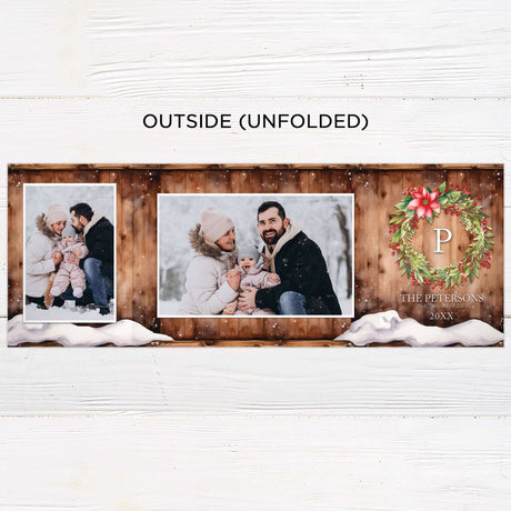 This gatefold holiday card features a cozy woodgrain background with a snow-dusted edge and watercolor floral wreath. Inside, it displays framed photos, festive typography with “Wishing You a Merry Christmas and a Happy New Year,” and a monogram accent. - outside.