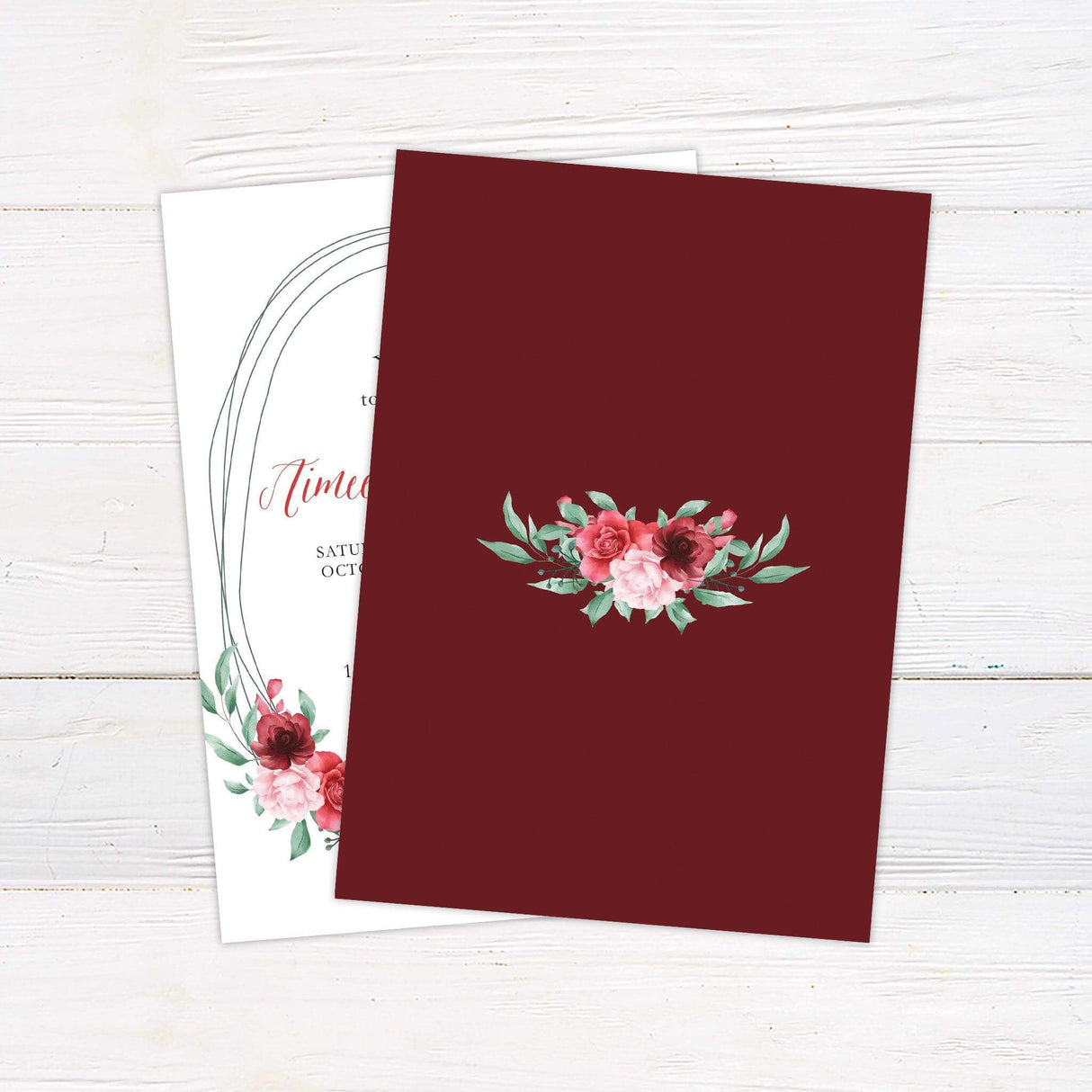 Printed garden-themed wedding invitation with blush and burgundy floral wreath and elegant calligraphy - back