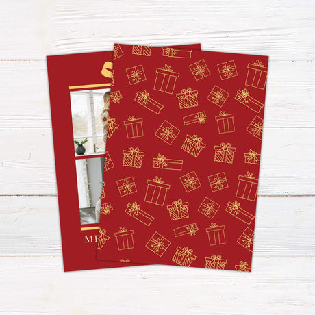 Gift Box Christmas card with red background, golden bow illustration, two family photo placements, and personalized holiday greeting text. - back.