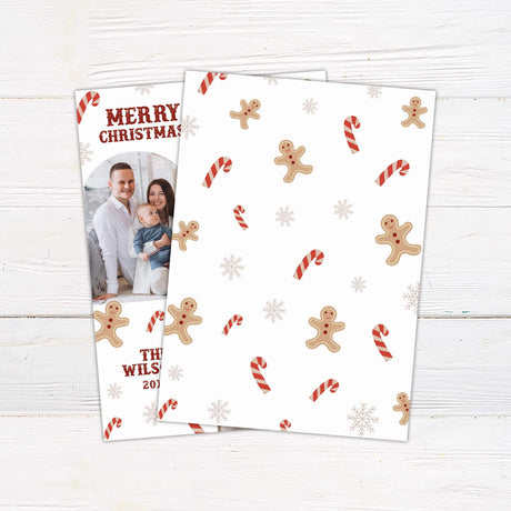 Family Christmas photo card with candy canes, gingerbread men, snowflakes, and personalized family name and year. back side