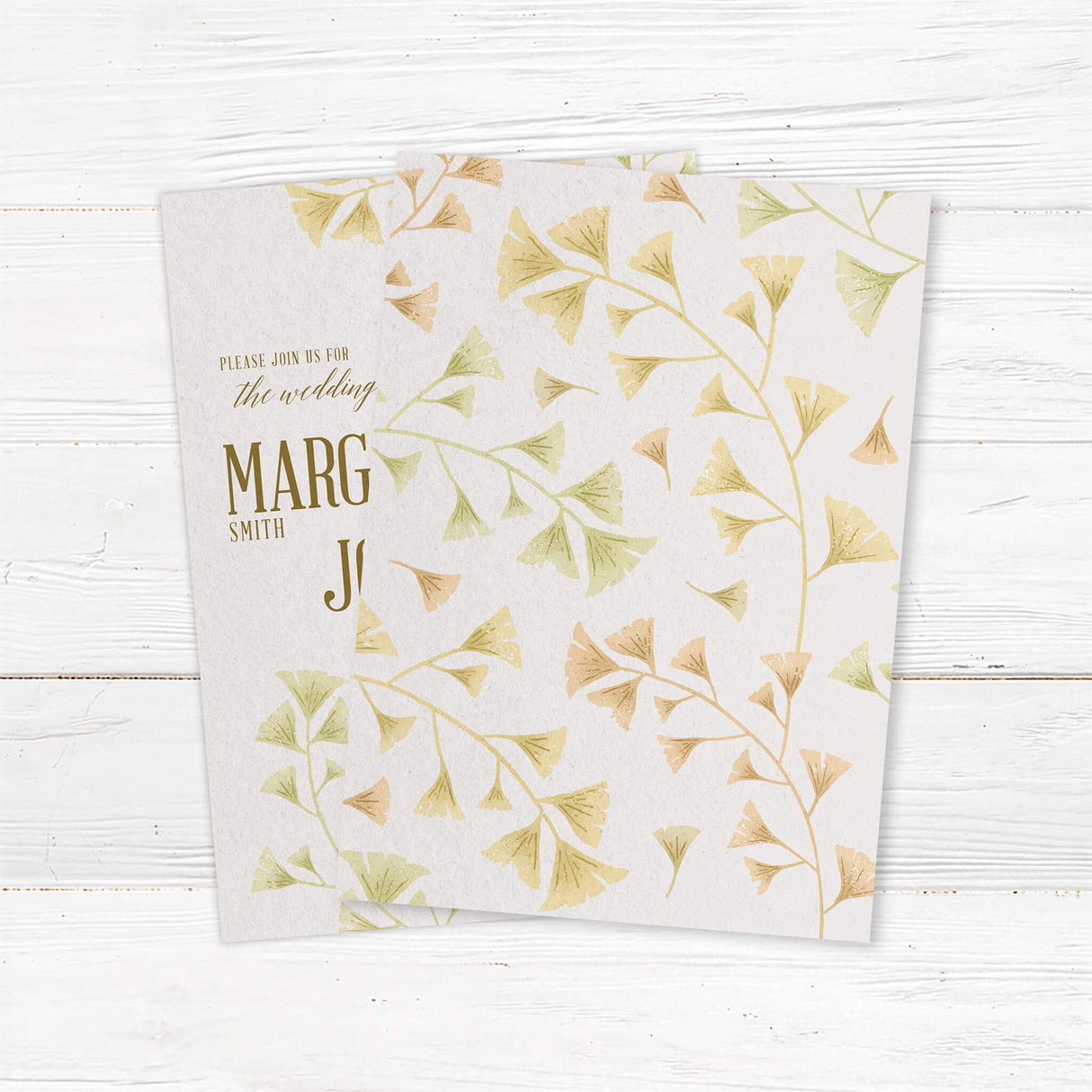Elegant ginkgo leaf wedding invitation with gold accents and botanical watercolor design. Printed on high-quality textured cardstock. Customizable with names, wedding date, and venue details. Ideal for minimalist, botanical, and rustic wedding themes. Includes matching envelopes for a complete wedding suite. back