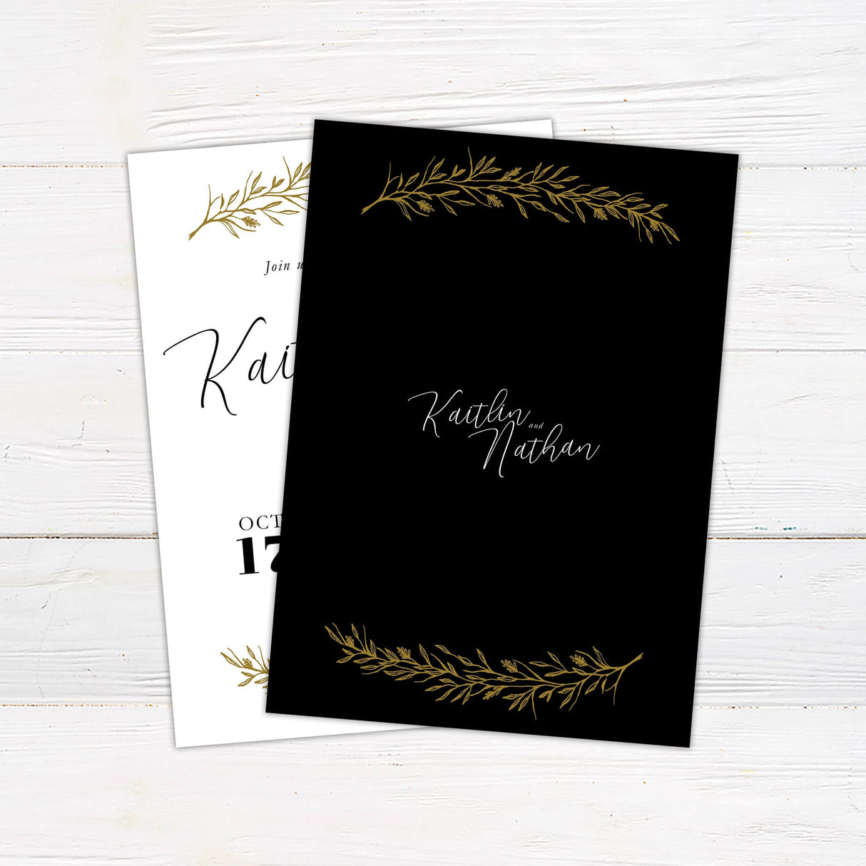Elegant wedding invitation with hand-drawn gold botanical branches, minimalist cream background, and a mix of script and serif text. back