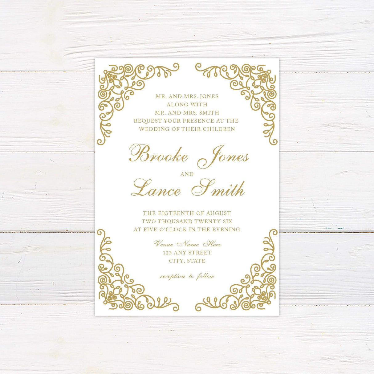 A wedding invitation with a classic white background features intricate gold filigree designs in the corners, creating an elegant and sophisticated frame. The text is arranged in a refined mix of serif and script fonts, highlighting the couple’s names and event details, including the date, time, and venue. This design exudes timeless luxury, making it perfect for formal, vintage, or traditional wedding celebrations.