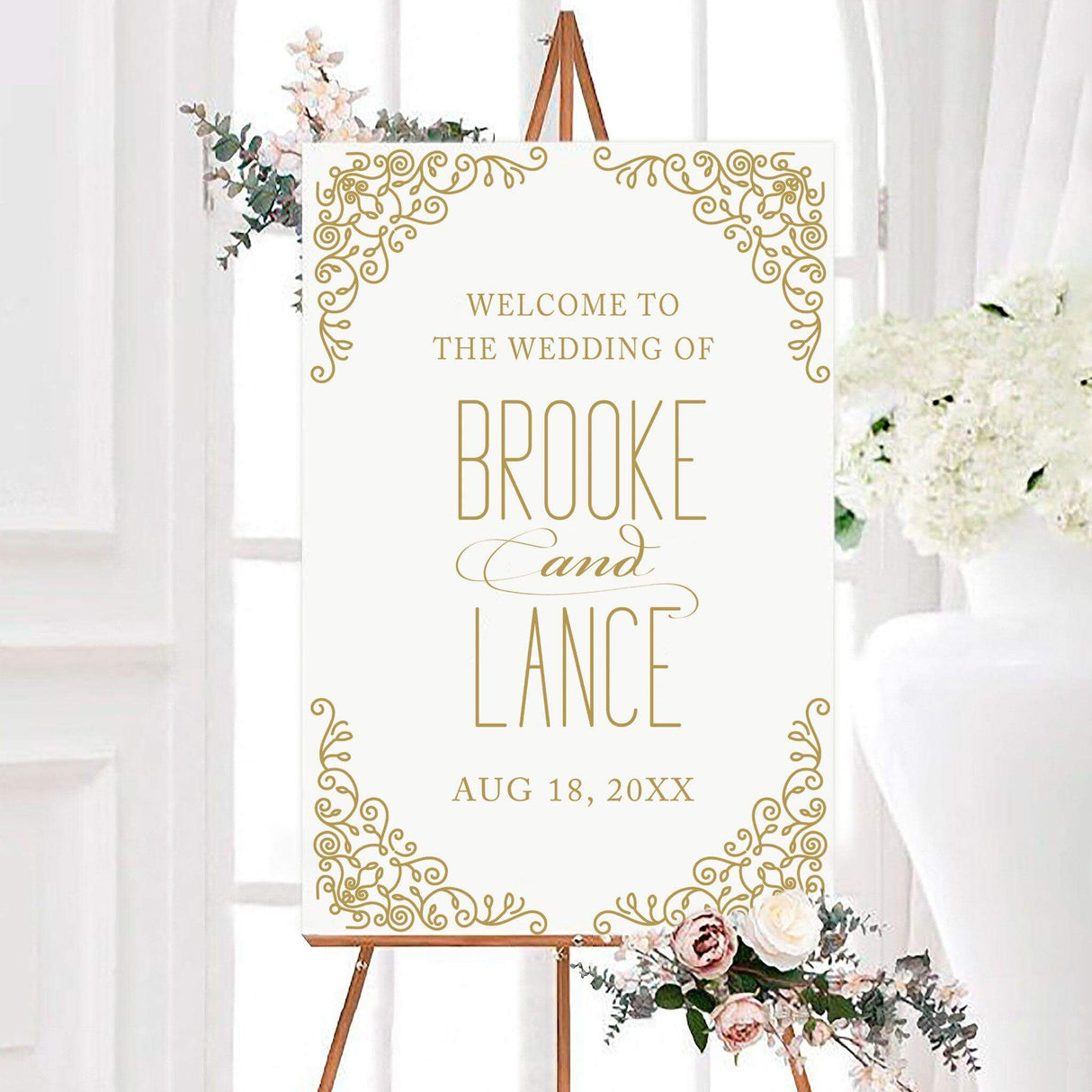 A sign with a classic white background features intricate gold filigree designs in the corners, creating an elegant and sophisticated frame. The text is arranged in a refined mix of serif and script fonts, highlighting the couple’s names. This design exudes timeless luxury, making it perfect for formal, vintage, or traditional wedding celebrations.