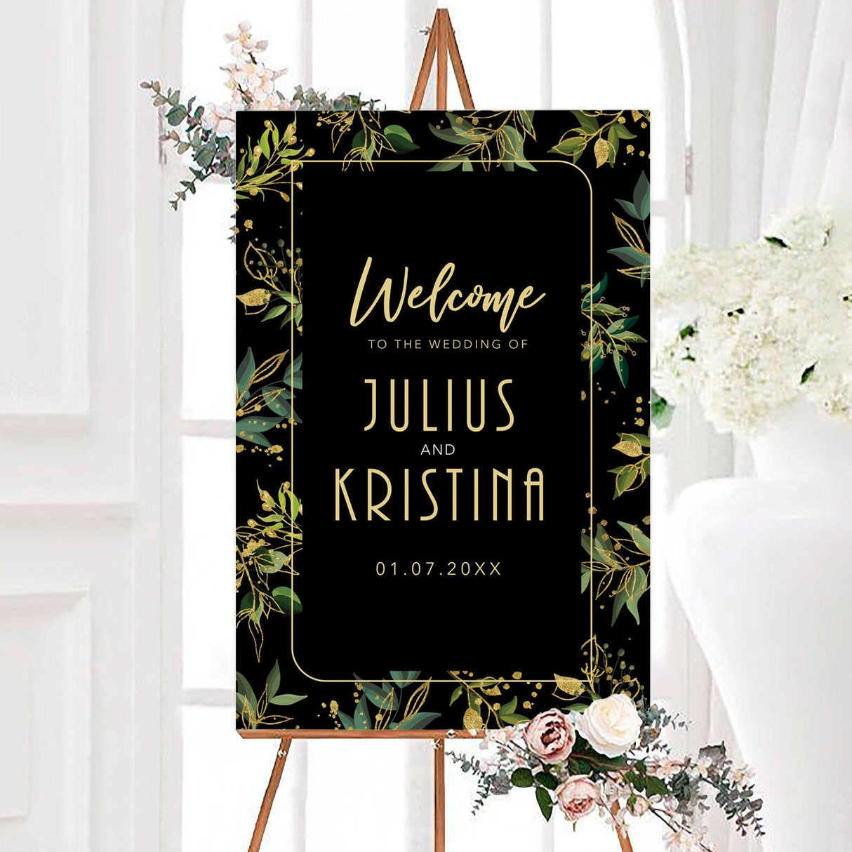 Elegant green and gold foliage wedding welcome sign with a dark background, green botanical foliage, gold-inspired accents, and a thin decorative border. The personalized design features the couple’s names and wedding date in modern gold lettering.