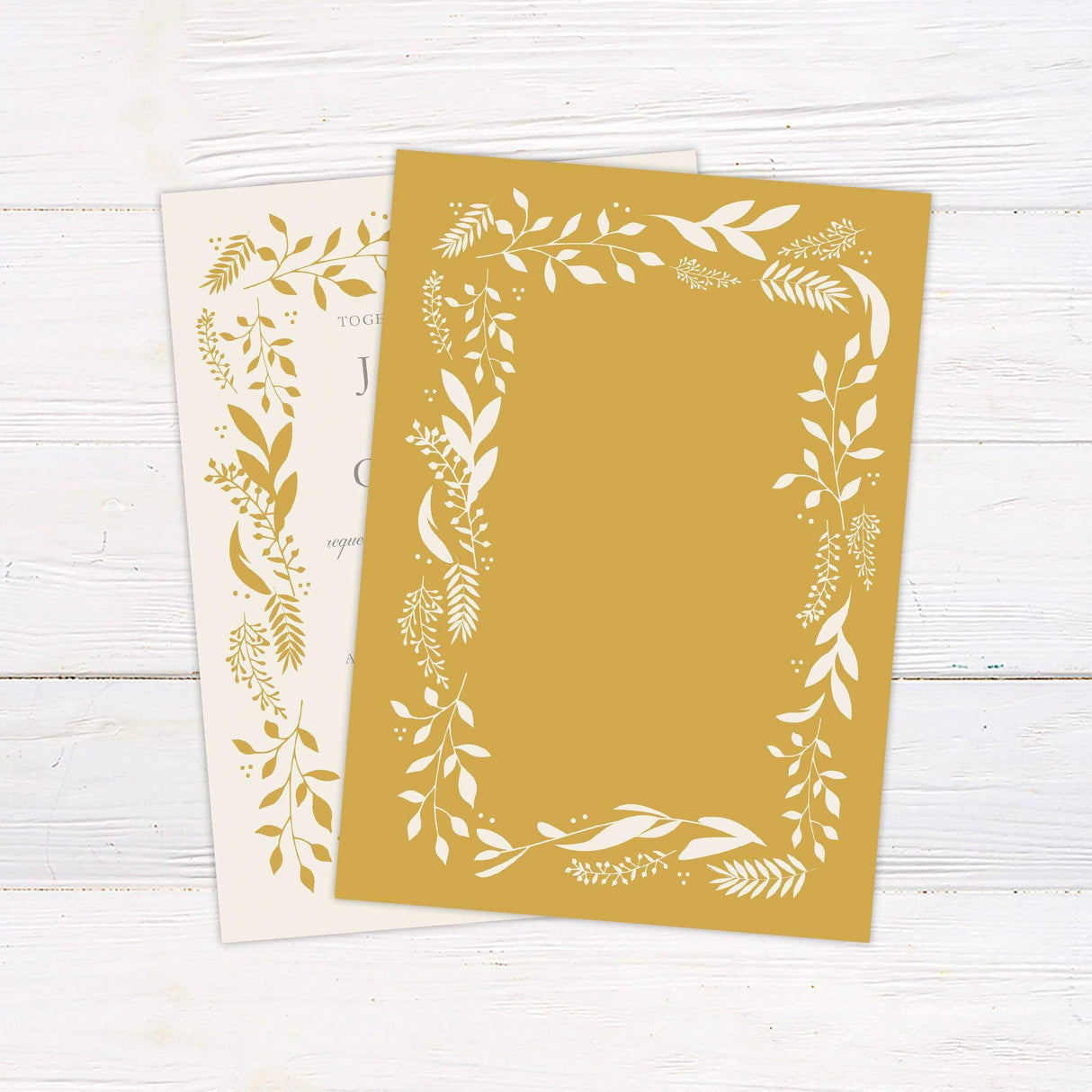 Wedding invitation with golden botanical leaf border, elegant serif and script fonts on ivory background - back
