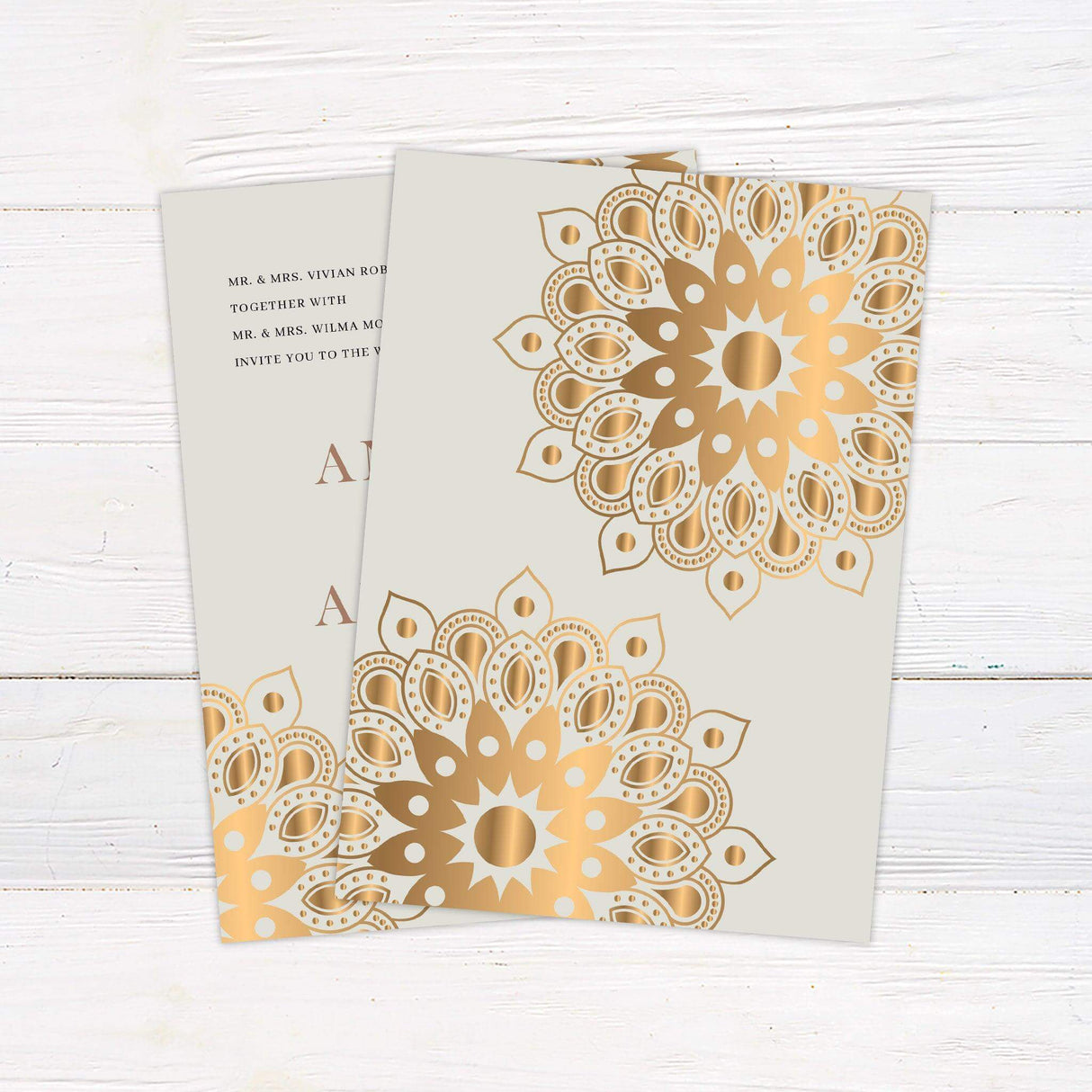 Wedding invitation with gold mandala pattern in corners, rose gold serif text on cream background, minimalist Indian-inspired design - back