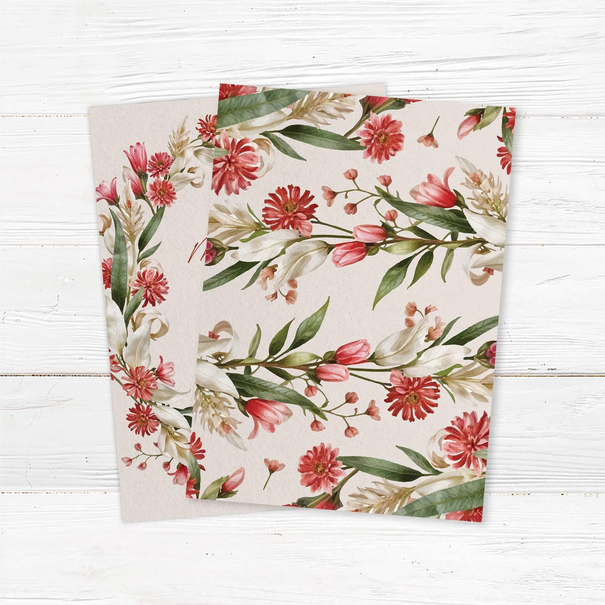 Elegant wedding invitation with a floral design featuring red, pink, and white flowers with green leaves arranged in a wreath. The text is in a mix of script and serif fonts on a cream-colored background, providing event details such as the couple's names, date, time, and location.  Back.