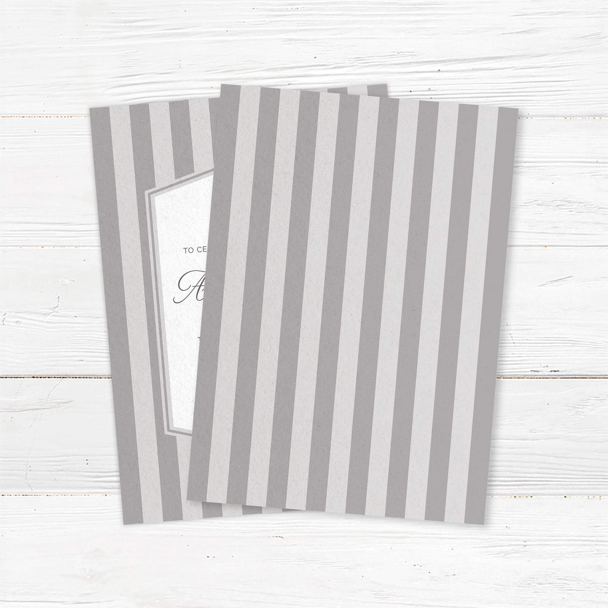Gray striped wedding invitation with monogram crest, white panel, and classic serif and script fonts- back side