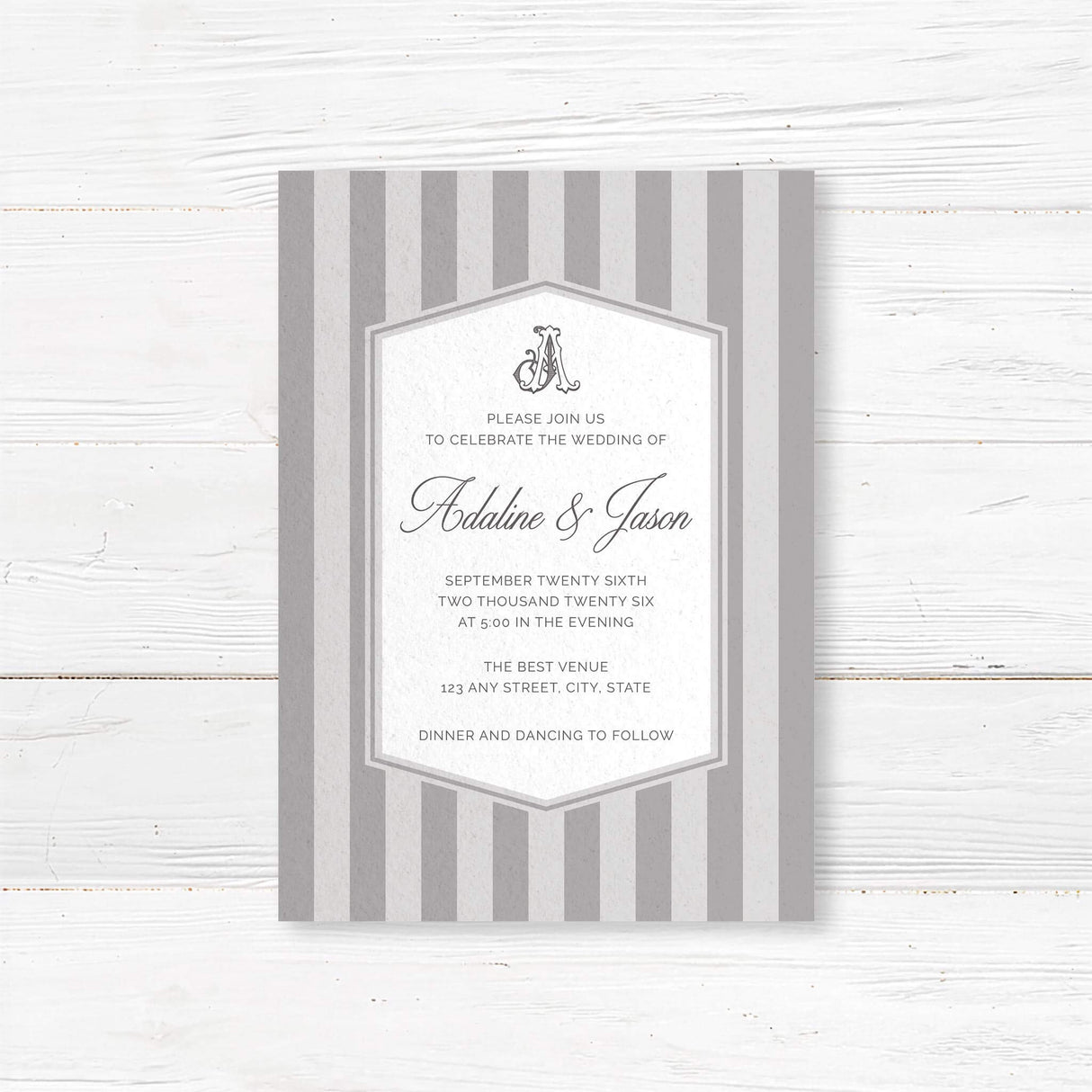 Gray striped wedding invitation with monogram crest, white panel, and classic serif and script fonts