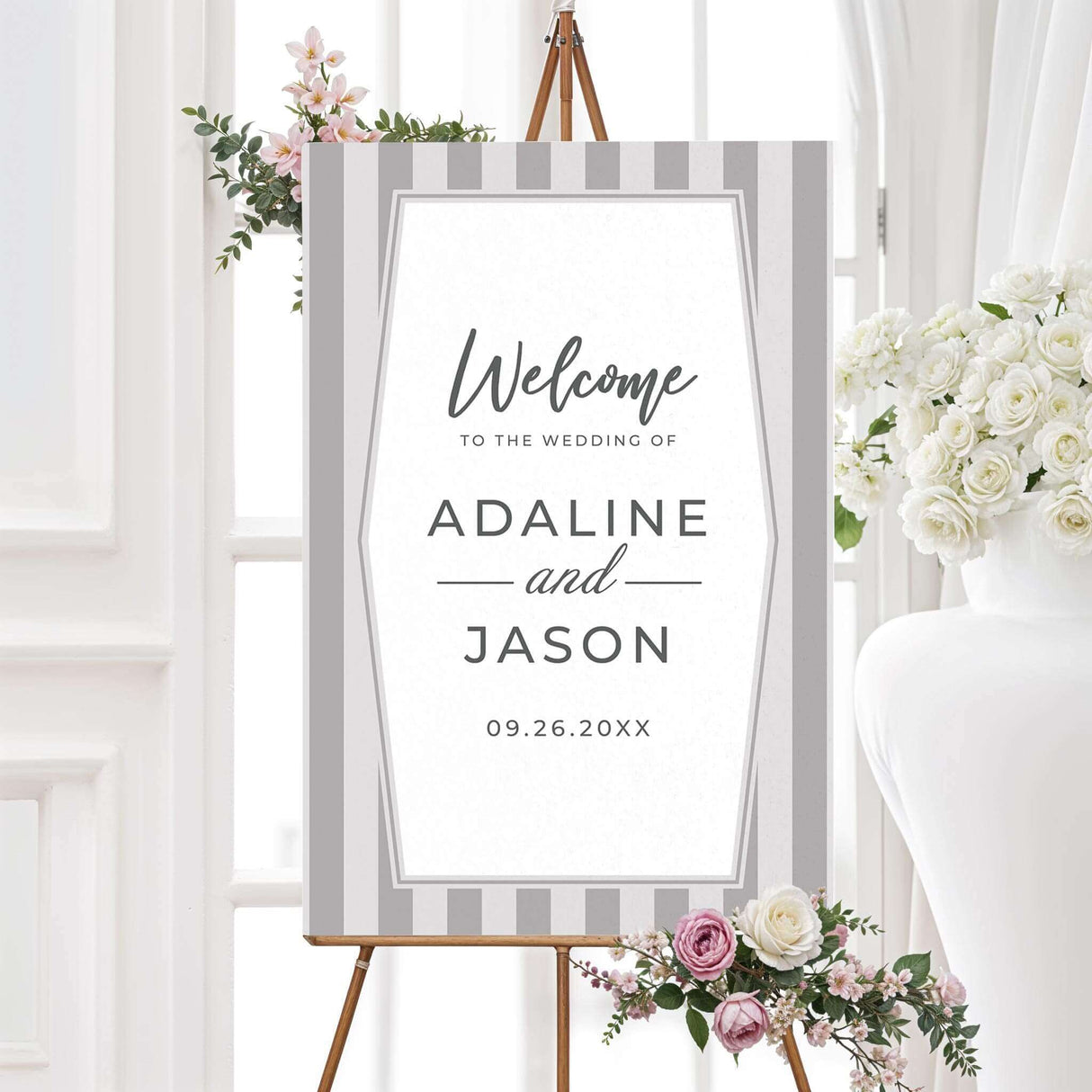 Gray wedding welcome sign with monogram and vertical stripes in a neutral color palette