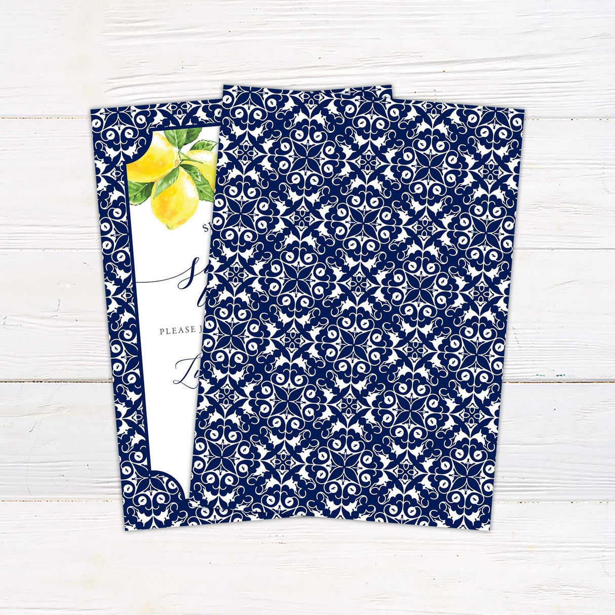Grecian Tile Main Squeeze Shower Invitation with intricate blue pattern and lemon design on white wooden background.