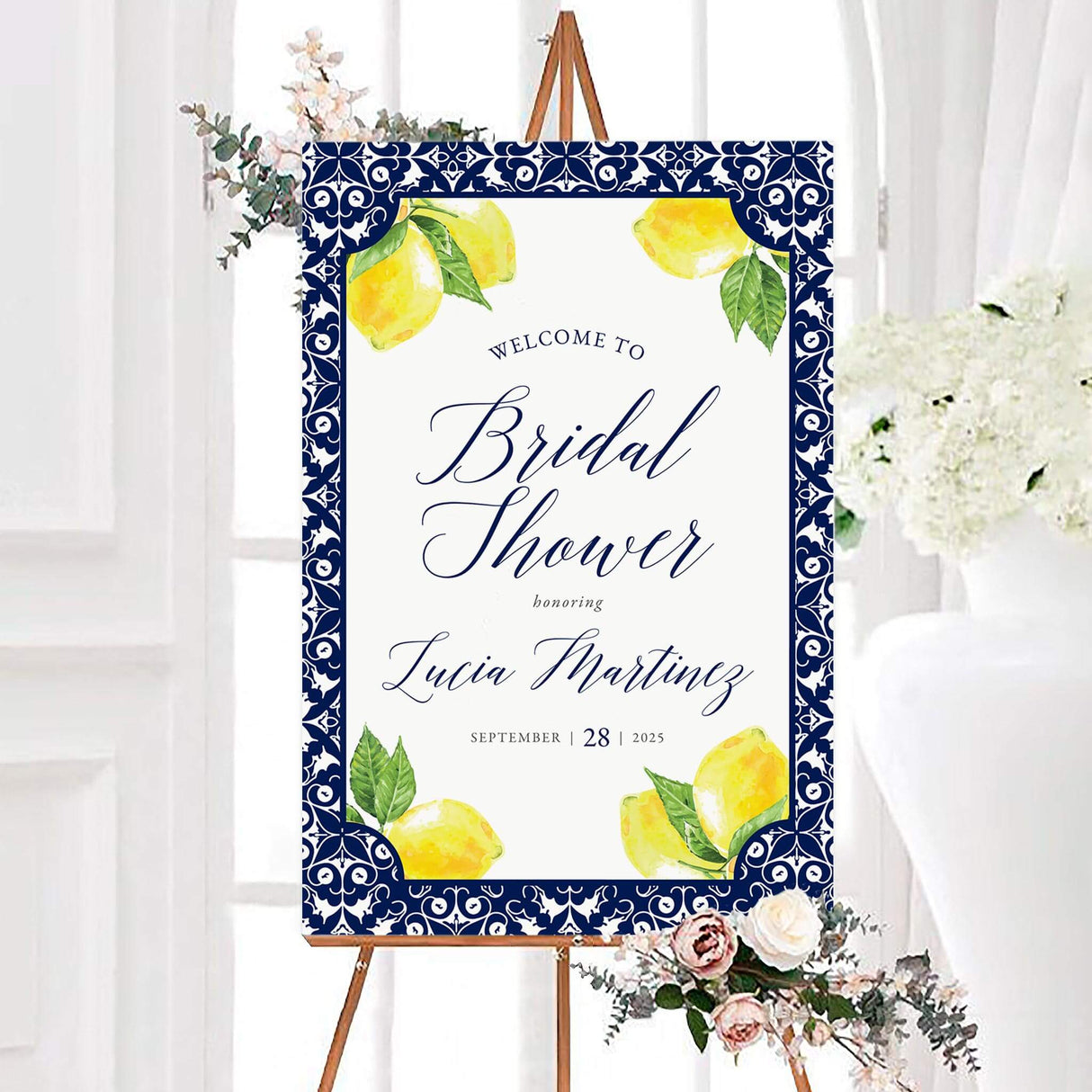 Grecian Tile Main Squeeze Bridal Shower Invitation with lemon design and floral accents on easel.