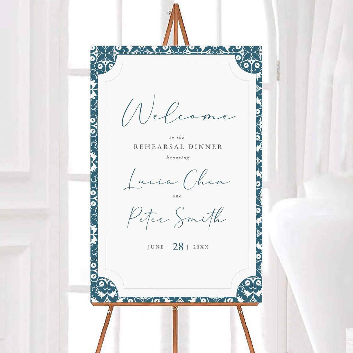 Elegant rehearsal dinner welcome sign with a blue and white ornate border. Features stylish script text displaying event details. Perfect for greeting guests at the venue entrance.