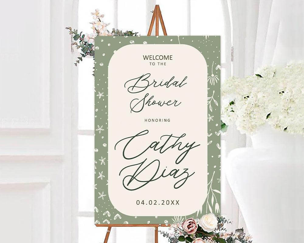 A sage green Green Border Sage with an arch-shaped center and floral border. The design features botanical accents and elegant script text.