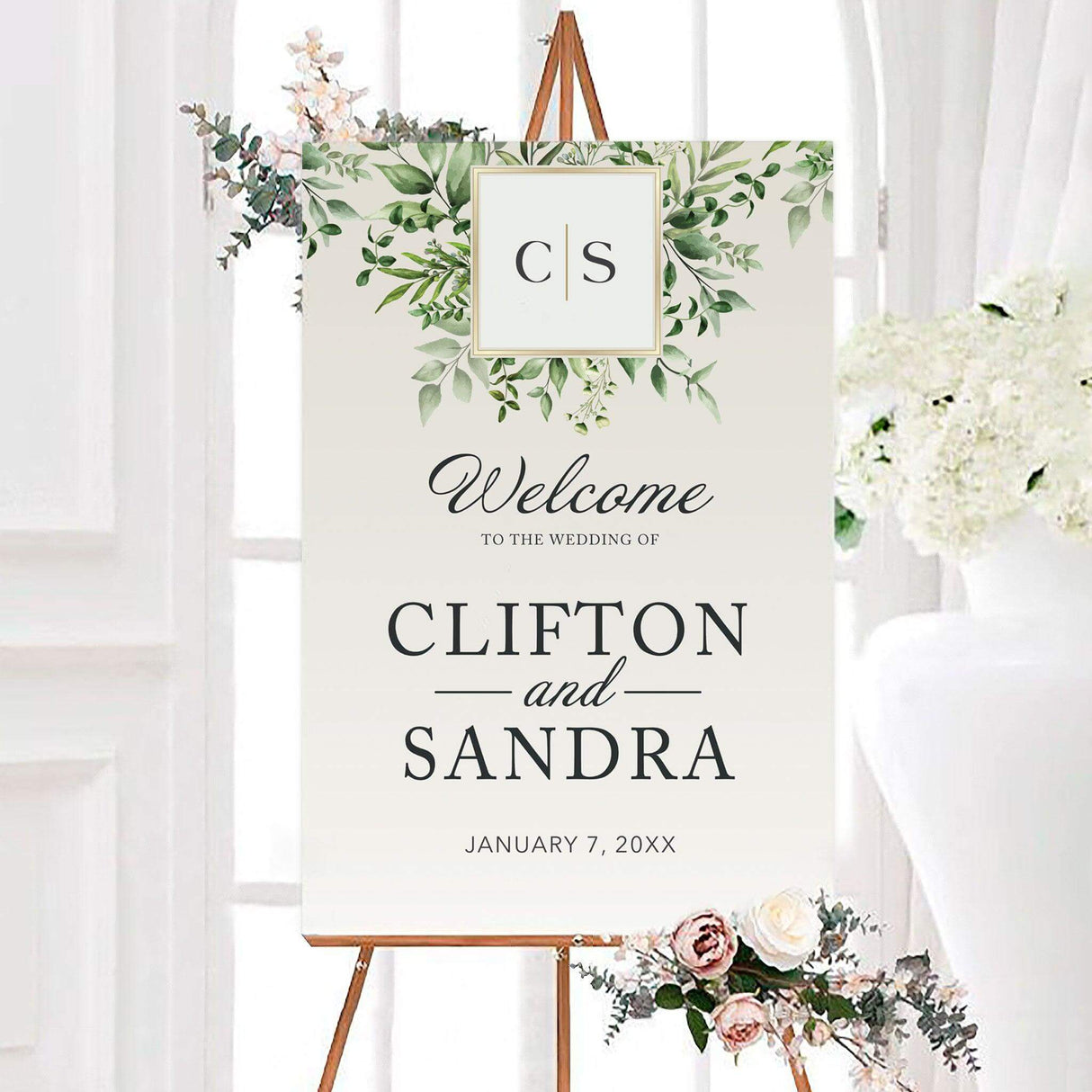 Elegant green monogram wedding welcome sign featuring watercolor greenery, a personalized monogram, and classic typography. The sign displays the couple’s names and wedding date on a clean neutral background.