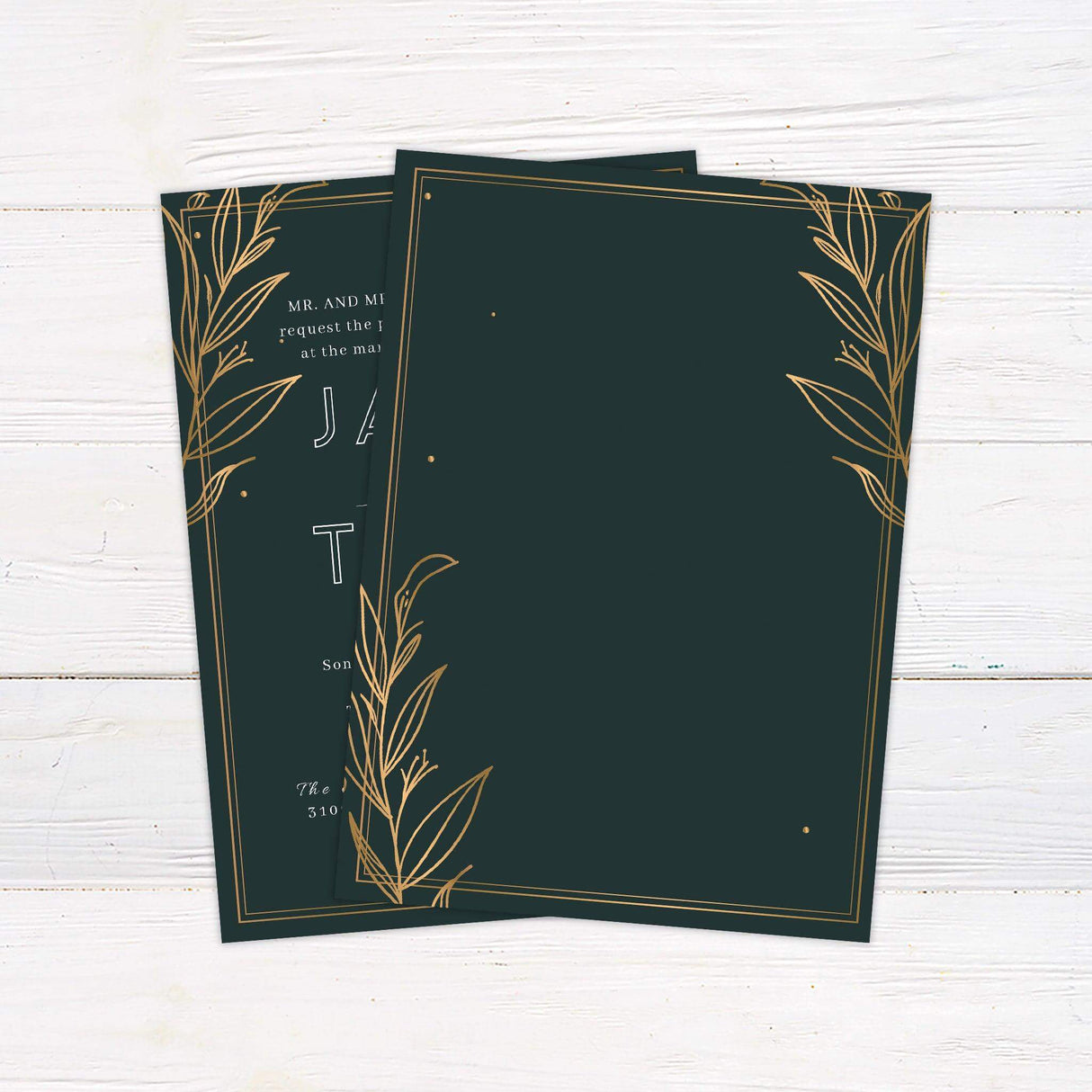 Elegant dark green wedding invitation with gold botanical leaf corner accents and modern white typography, perfect for fall or formal celebrations - back