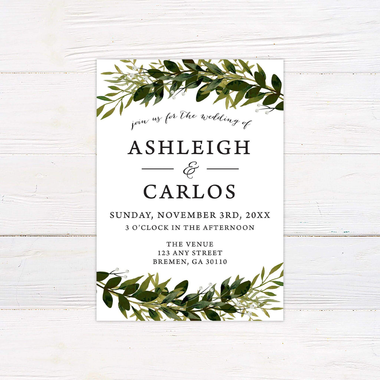 Greenery wedding invitation with top and bottom foliage border, elegant serif and script fonts on white background