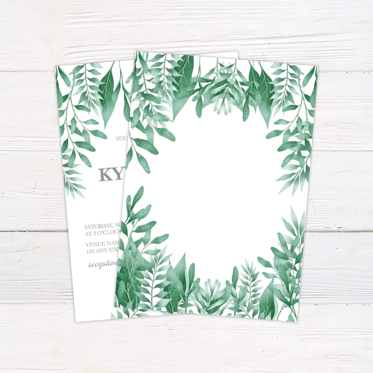 Elegant botanical wedding invitation with watercolor sage green leaves framing the corners and soft script typography on a white background. back