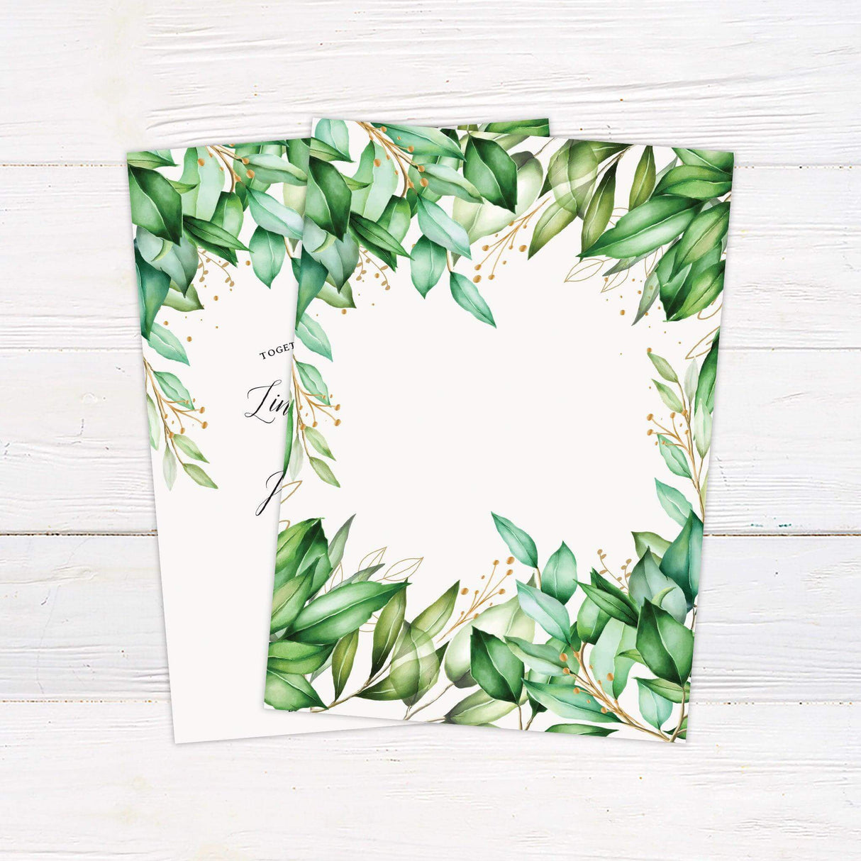 Elegant greenery and gold wedding invitation with watercolor leaves and calligraphy text on white background - back