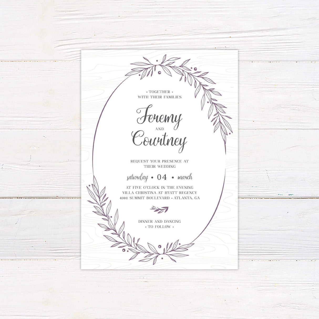 Rustic wedding invitation with hand-drawn botanical wreath, elegant script and serif fonts, and a woodgrain textured background