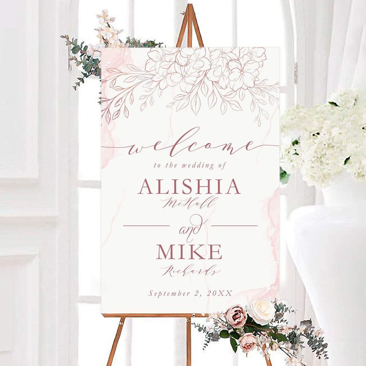 Personalized hand drawn flowers wedding welcome sign featuring delicate hand-drawn flowers, leafy branches, and soft watercolor-inspired accents. Elegant script and serif typography display the couple’s names and wedding date.