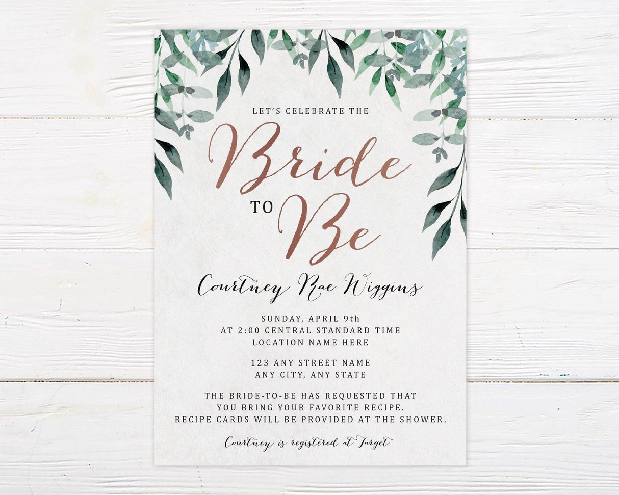 A hanging leaves bridal shower invitation with green leafy branches around the edges. The design uses soft neutral colors and elegant script text.