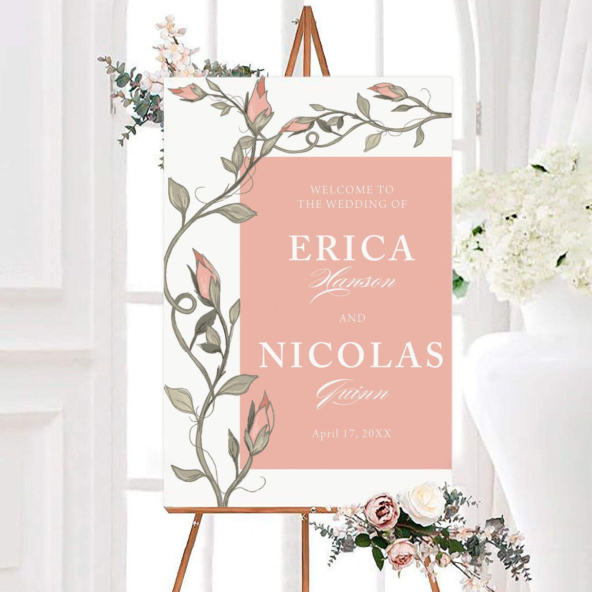 Romantic happily ever after wedding welcome sign featuring delicate climbing rose vines, soft floral buds, and elegant personalized typography. The design displays the couple’s names and wedding date within a simple rectangular center panel.