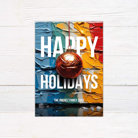 Happy Holidays card with abstract colorful paint background, red ornament, and personalized family name text.