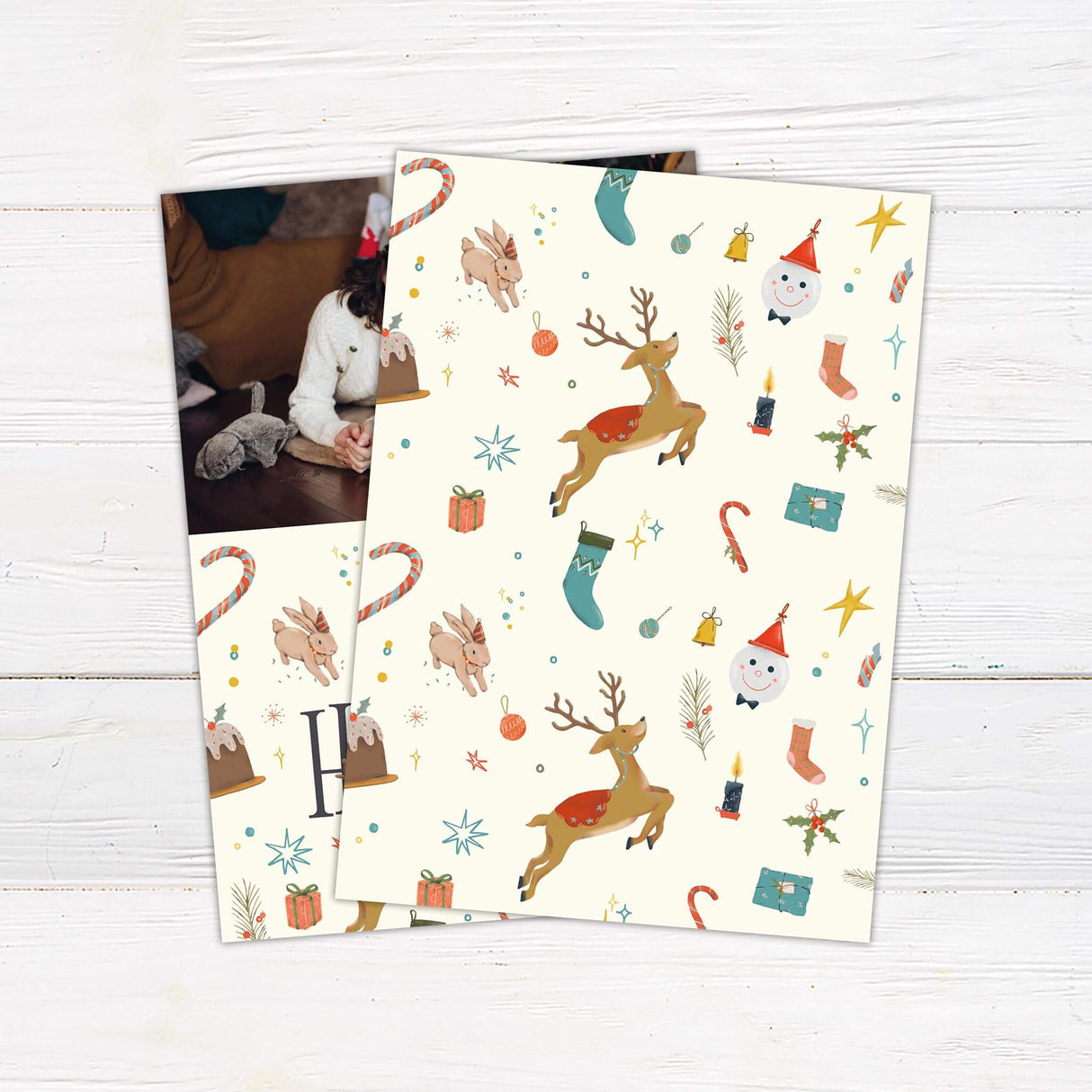 Happy Holidays photo card with family picture, festive illustrations of reindeer, bunny, snowman, gifts, holly, and personalized holiday greeting. - back.